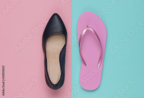 Leather high heel shoes and flip flops on a colored paper background. Minimalistic fashion concept. Top view