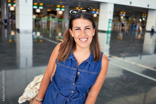 Young traveller woman at the airport going on vacation