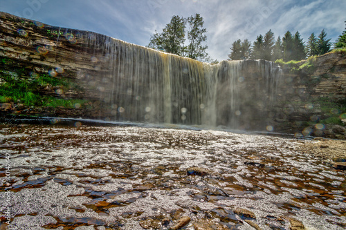 Jagala Waterfall (juga) is waterfall in Northern Estonia on Jagala River. highest natural waterfall in Estonia height 8 meters. Summer sunny day. Jagala-Joa, Joelahtme Parish, Harju County, Estonia photo