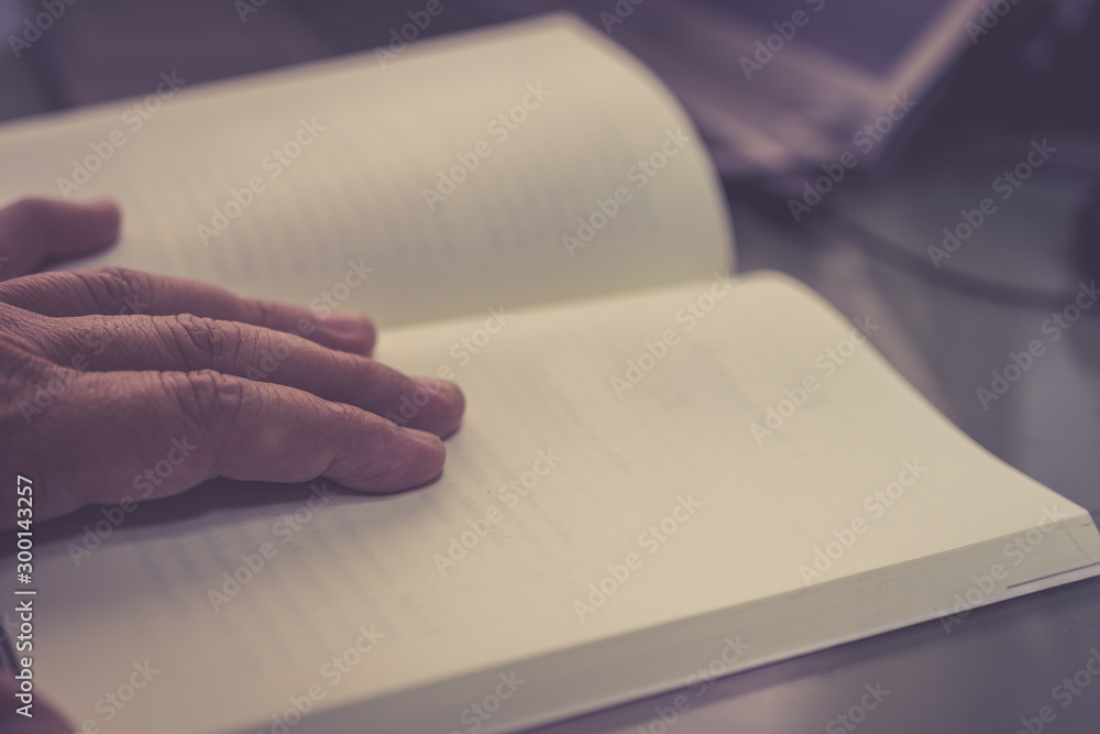 The hand is opening the notebook Blank page Retro color tone The hand is opening the notebook Blank page Retro color tone