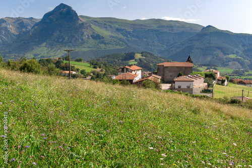 Gaintza village in Goierri with Txindoki mountain as background, Basque Country, Spain photo