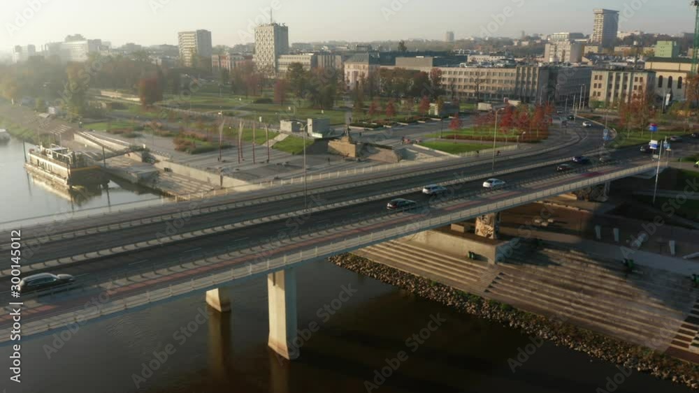 Aerial view of a beautiful sunrise and a river with bridges and a stadium. Cityscape with river and bridges in the morning in the fog. Warsaw. Poland. Aerial view of a beautiful sunrise and a river with bridges and a stadium. Cityscape with river and bridges in the morning in the fog. Warsaw. Poland.
