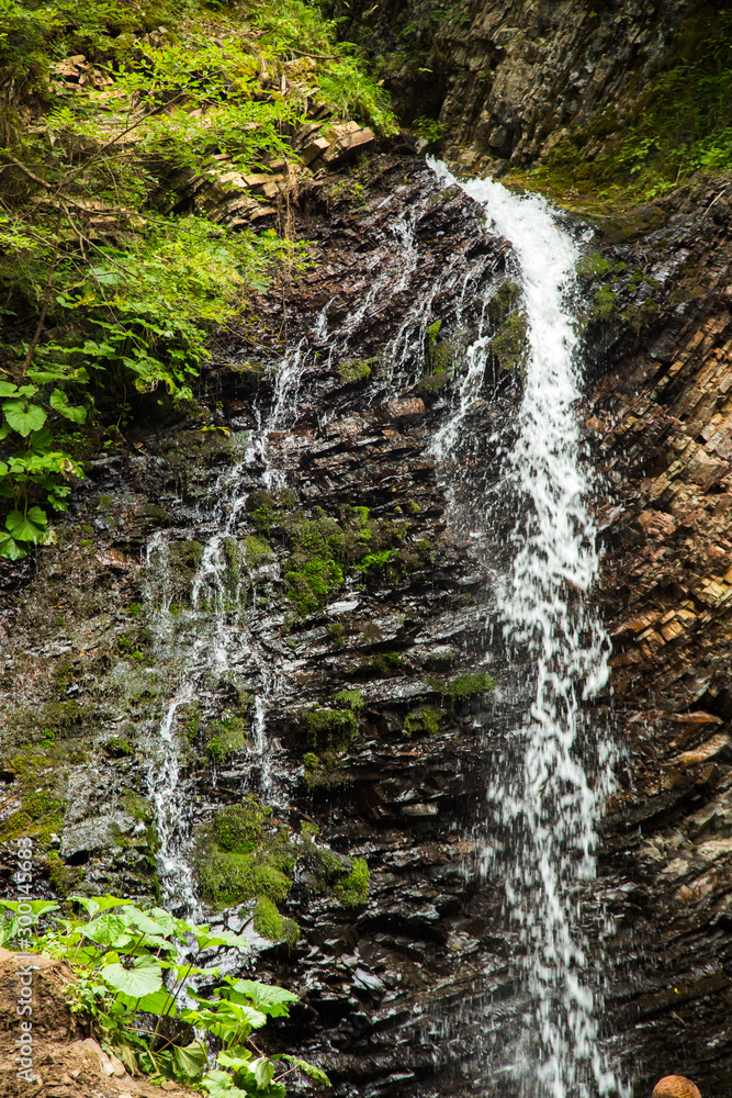 Guk Waterfall in Carpathian mountains in summer. Beautiful nature of Ukraine. Guk Waterfall in Carpathian mountains in summer. Beautiful nature of Ukraine.