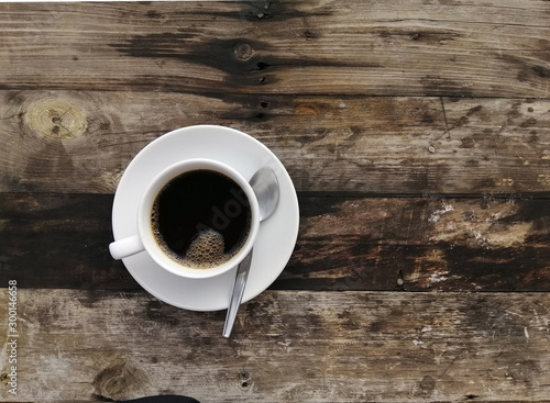 cup of coffee on wooden table