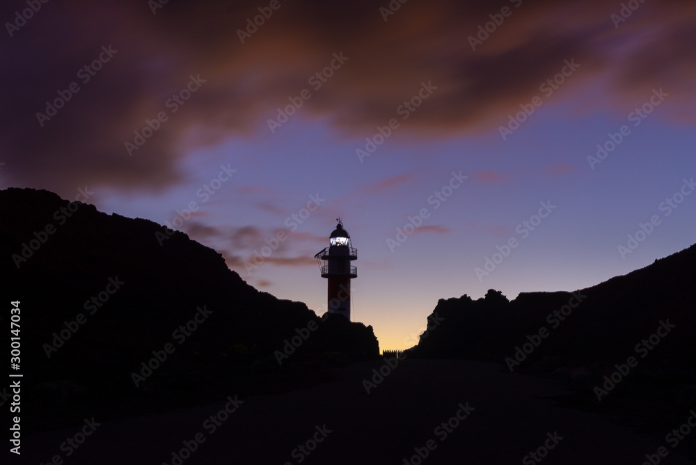 Lighthouse of Punta de Teno cape at dusk in Tenerife island, Spain