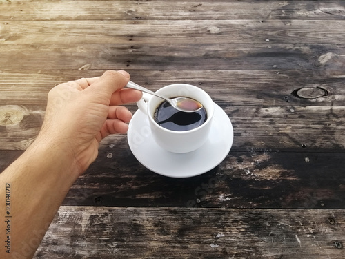 hand holding a cup of coffee