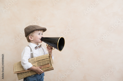 Fényképezés Child shouting through vintage megaphone