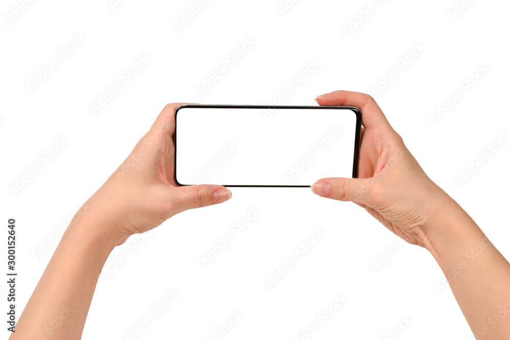 Smart phone in woman hands isolated on white background. White screen. Copy space. Smart phone in woman hands isolated on white background. White screen. Copy space.
