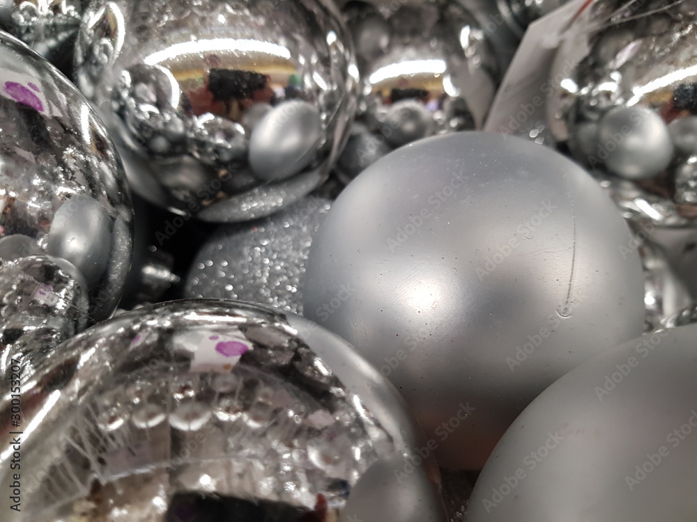 A bunch of silver Christmas balls.