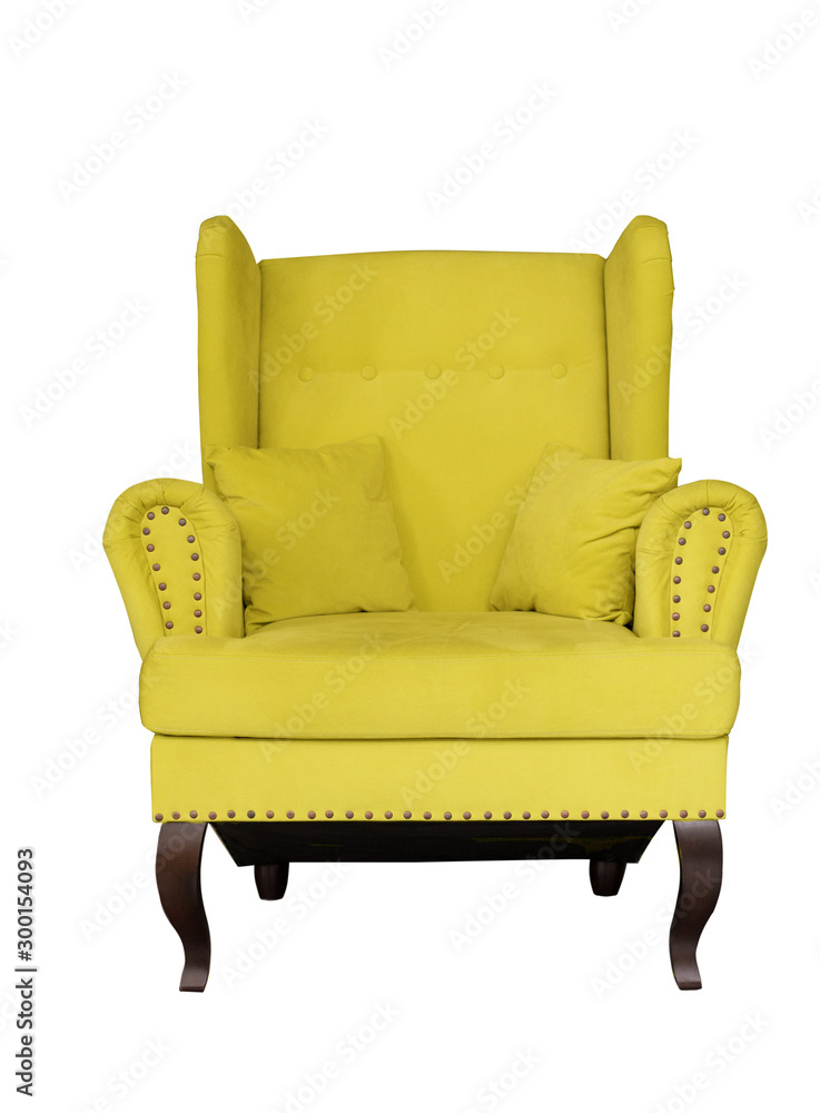 Yellow soft chair with pillows on wooden legs. Upholstered furniture for the living room. Yellow armchair isolated Yellow soft chair with pillows on wooden legs. Upholstered furniture for the living room. Yellow armchair isolated