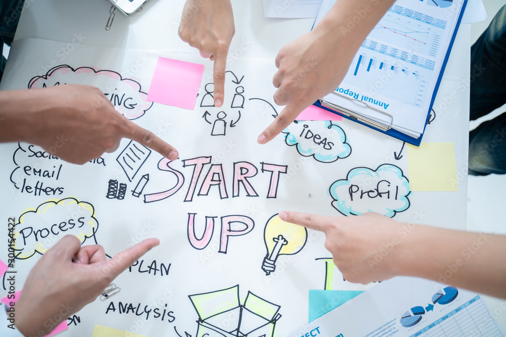 Start up and Successful Concept.Business people hand point of start up word after contract agreement to become a partner,Finishing up a meeting,collaborative teamwork. Start up and Successful Concept.Business people hand point of start up word after contract agreement to become a partner,Finishing up a meeting,collaborative teamwork.