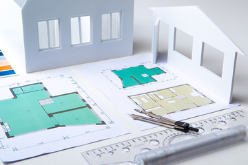Architectural company. Architect. Office of the architectural bureau. Small copy of the house. Drawings on the architect's desk. Architectural decisions. Work with floor plans. Matching.