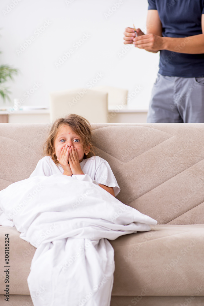 Father taking care of his ill daughter Father taking care of his ill daughter