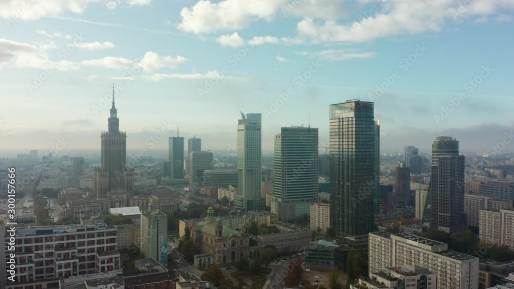 Aerial view of glass skyscrapers and buildings in the business center of Warsaw. Poland. 12. June. 2019. Drone whistled on modern skyscrapers and buildings on a foggy morning. Aerial view of glass skyscrapers and buildings in the business center of Warsaw. Poland. 12. June. 2019. Drone whistled on modern skyscrapers and buildings on a foggy morning.