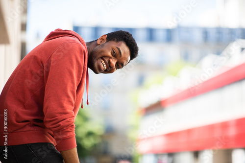 Side of smiling african american man outside