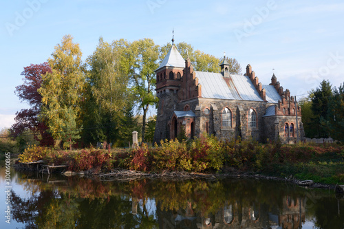 View of Saint Сlaire church (catholic), castle, lake. Gorodivka village, Ukraine