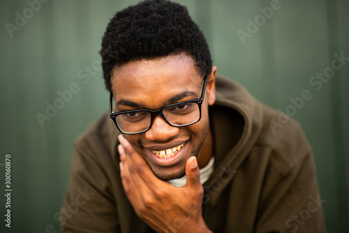 Close up handsome young african american man with glasses laughing