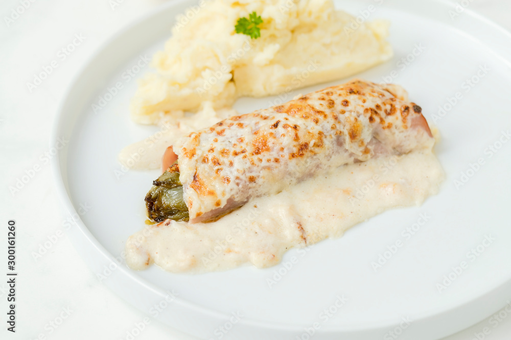 Belgian dish Chicory gratin served with mashed patatoes Belgian dish Chicory gratin served with mashed patatoes