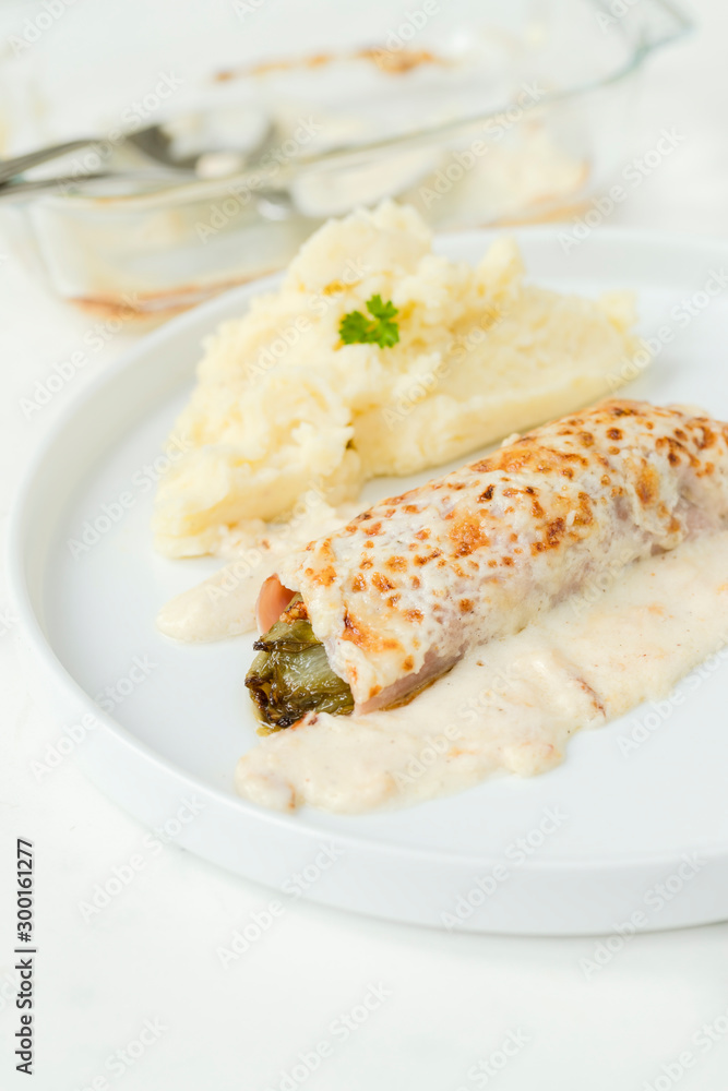 Belgian dish Chicory gratin served with mashed patatoes Belgian dish Chicory gratin served with mashed patatoes