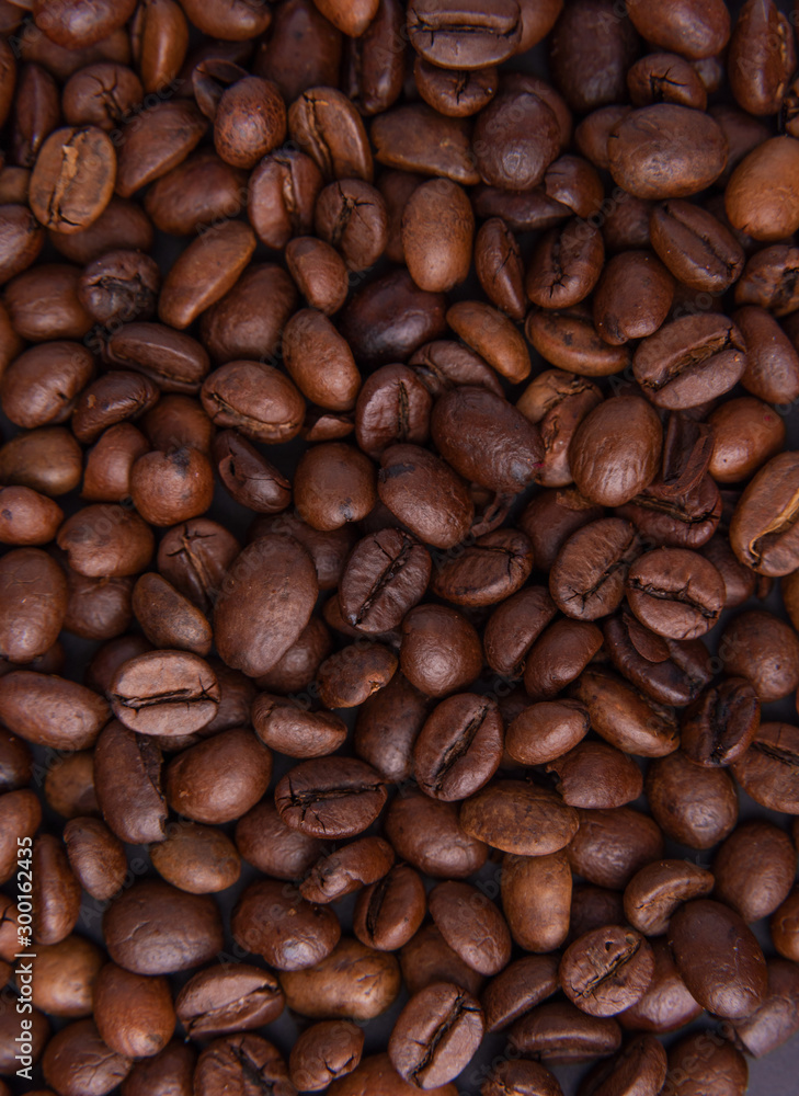 Beautiful composition of coffee beans, utensils for making coffee and decor in the form of almonds, dried slices of lemon, peanut and cinnamon on black and blue backgrounds. Beautiful composition of coffee beans, utensils for making coffee and decor in the form of almonds, dried slices of lemon, peanut and cinnamon on black and blue backgrounds.