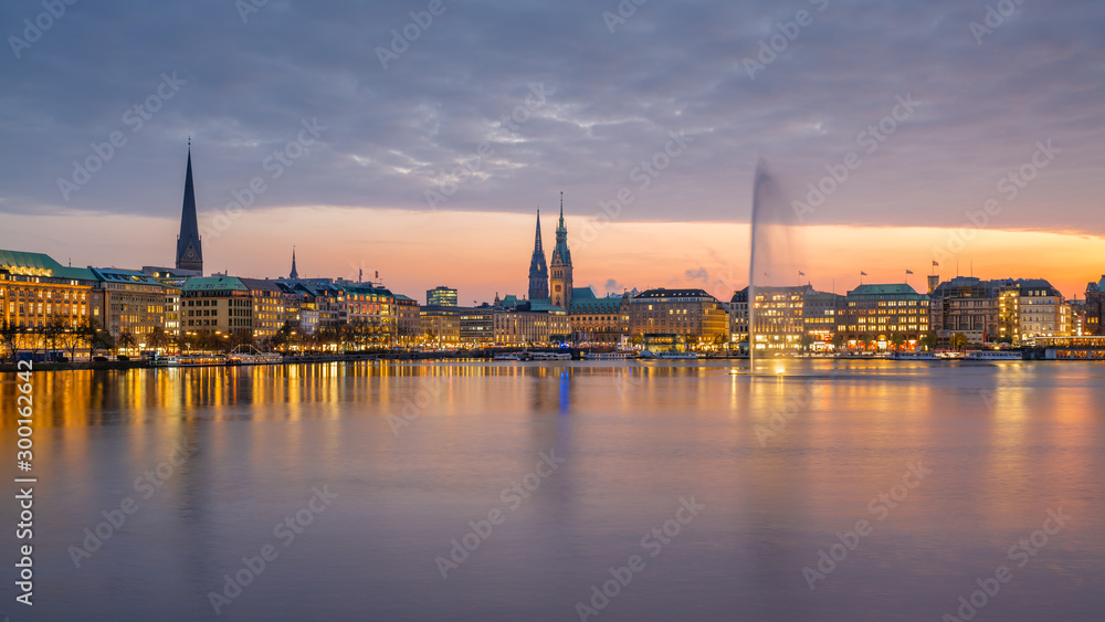 Hamburg, Germany. The Inner Alster Lake (German: Binnenalster) in the evening with cityscape.