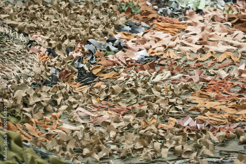 Handmade camouflage mesh. The world's longest camouflage made from rags and cloth pieces. The grid is made by civilians in support of peace. Voluntary action to end the war. Handmade camouflage mesh. The world's longest camouflage made from rags and cloth pieces. The grid is made by civilians in support of peace. Voluntary action to end the war.
