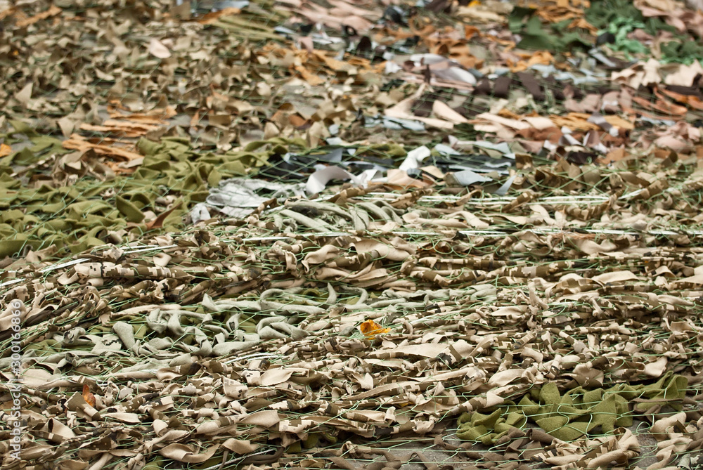 Handmade camouflage mesh. The world's longest camouflage made from rags and cloth pieces. The grid is made by civilians in support of peace. Voluntary action to end the war.