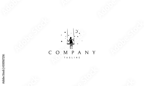Vector logo on which an abstract image of a girl riding on a swing under the starry sky .