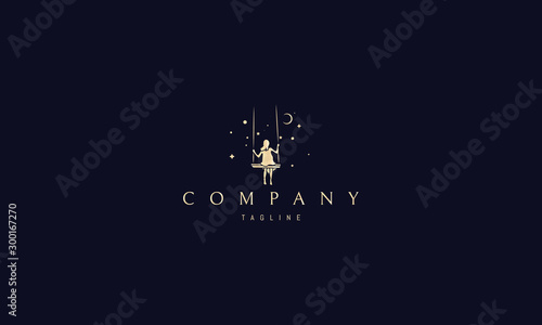 Vector golden logo on which an abstract image of a girl riding on a swing under the starry sky .
