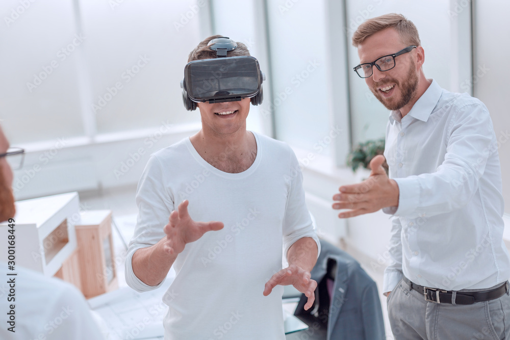 Fototapeta premium architects and designer using VR helmet in office