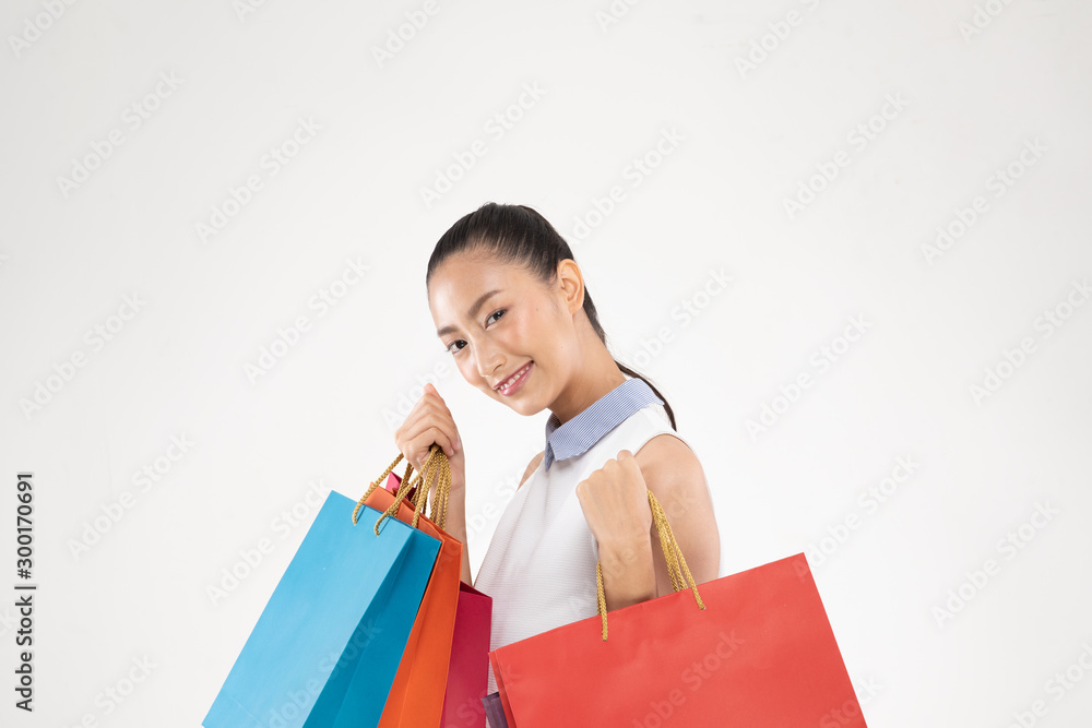 Shopping Asian woman smile and Holding Shopping bags,Cheerful and happiness emotional,Enjoy Shopping in black friday sale,Isolated on gray background,Shopping Concept Shopping Asian woman smile and Holding Shopping bags,Cheerful and happiness emotional,Enjoy Shopping in black friday sale,Isolated on gray background,Shopping Concept
