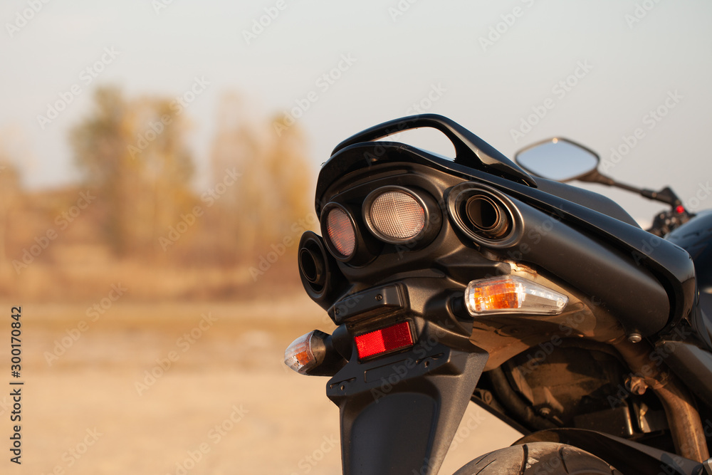 Fototapeta premium One black motorcycle in the desert.
