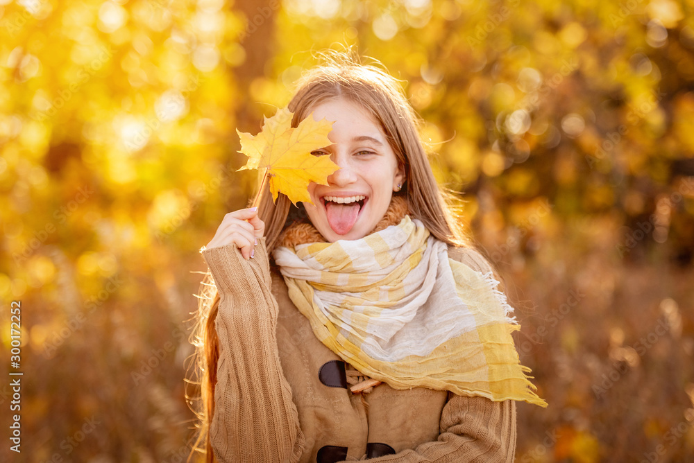 Funny girl with autumn leaf Funny girl with autumn leaf