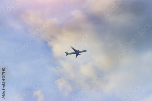 a plane flying high in the clouds
