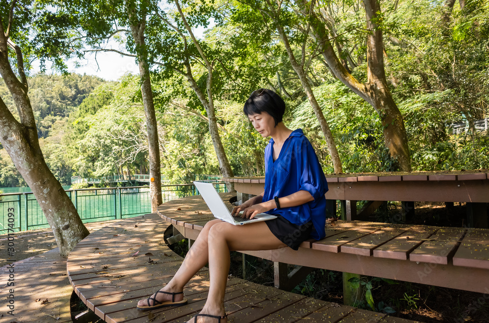 Fototapeta premium woman working at outdoor