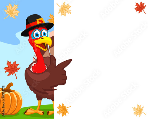 Turkey in a hat points a wing to a white sheet, a place for text. Thanksgiving day.