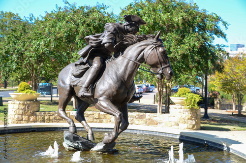 Captain James Jack statue in Elizabeth Park. Charlotte NC. Sitting in a fountain is the bronze statue. Famous in the revolutionary times.