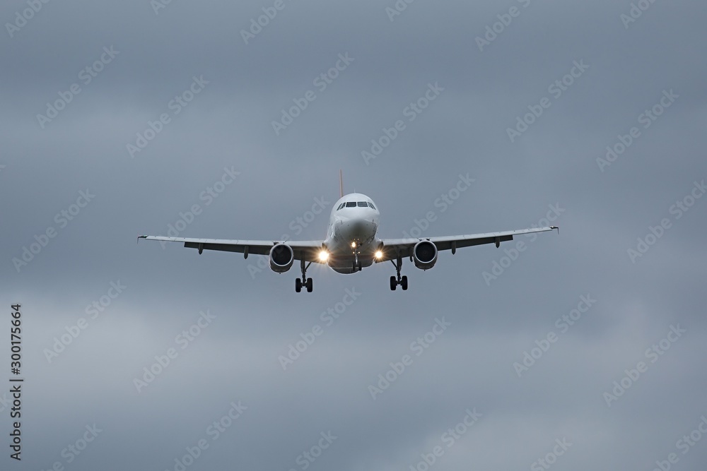 Plane approaching with landing lights Plane approaching with landing lights