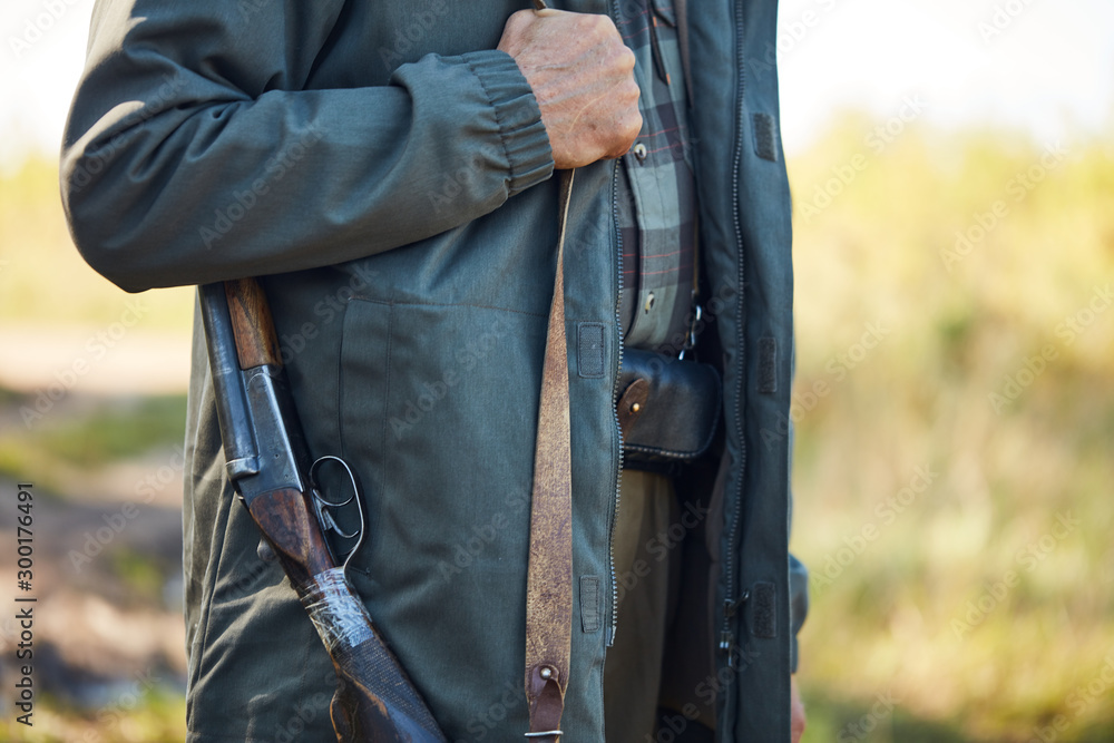 Unrecognizable person, man go hunting in forest Unrecognizable person, man go hunting in forest