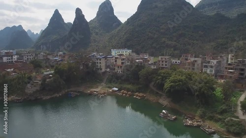 Cityscape of Yizhou with karst hills, Guangxi Province, China. Aerial view of the natural landscape and the village. photo