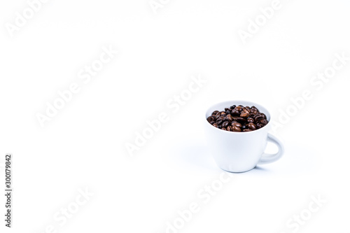 Cup with coffee bean on white