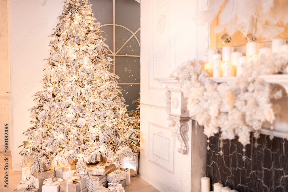 Background christmas interior New Year tree and artificial fireplace decorated light for holiday, white color