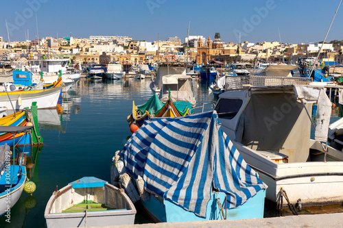 Marsaxlokk. Traditional boats Luzzu in the old harbor. photo