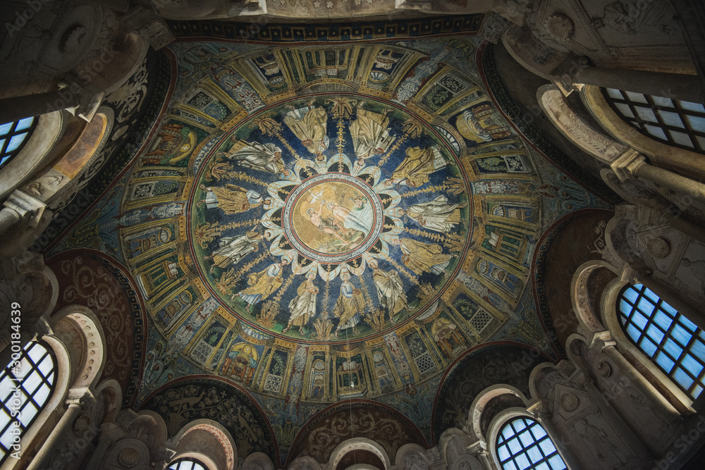 RAVENNA, ITALY - September 11, 2019: Magnificent mosaic painting on the ceiling of the baptistery of Neon, built in the 5th century. Showing the Baptism of Jesus, the apostles around. South Europe.