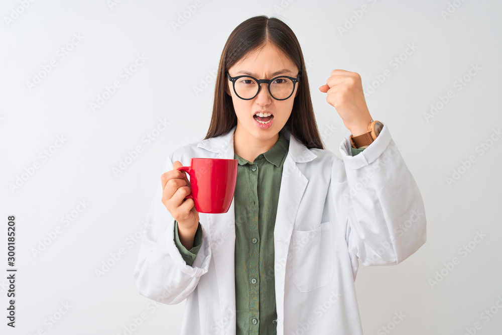 Young chinese dooctor woman wearing glasses drinking coffee over isolated white background annoyed and frustrated shouting with anger, crazy and yelling with raised hand, anger concept Young chinese dooctor woman wearing glasses drinking coffee over isolated white background annoyed and frustrated shouting with anger, crazy and yelling with raised hand, anger concept