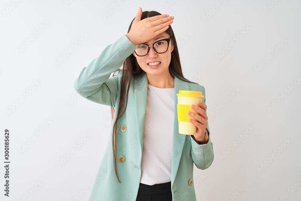 Young chinese woman wearing glasses drinking coffe over isolated white background stressed with hand on head, shocked with shame and surprise face, angry and frustrated. Fear and upset for mistake. Young chinese woman wearing glasses drinking coffe over isolated white background stressed with hand on head, shocked with shame and surprise face, angry and frustrated. Fear and upset for mistake.