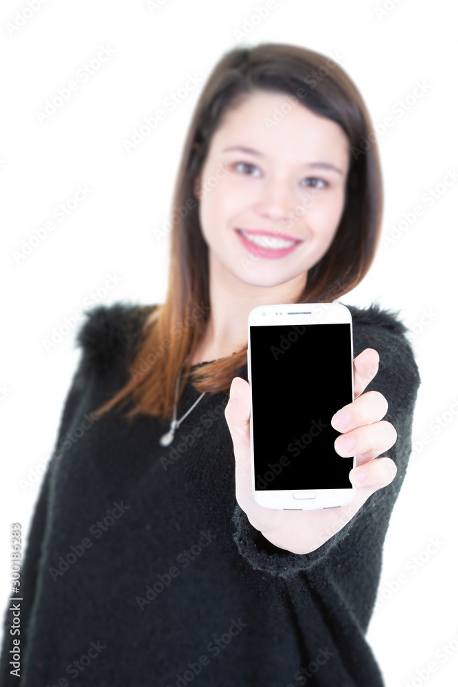 Portrait of pretty young woman standing isolated with empty screen phone smartphone mockup black