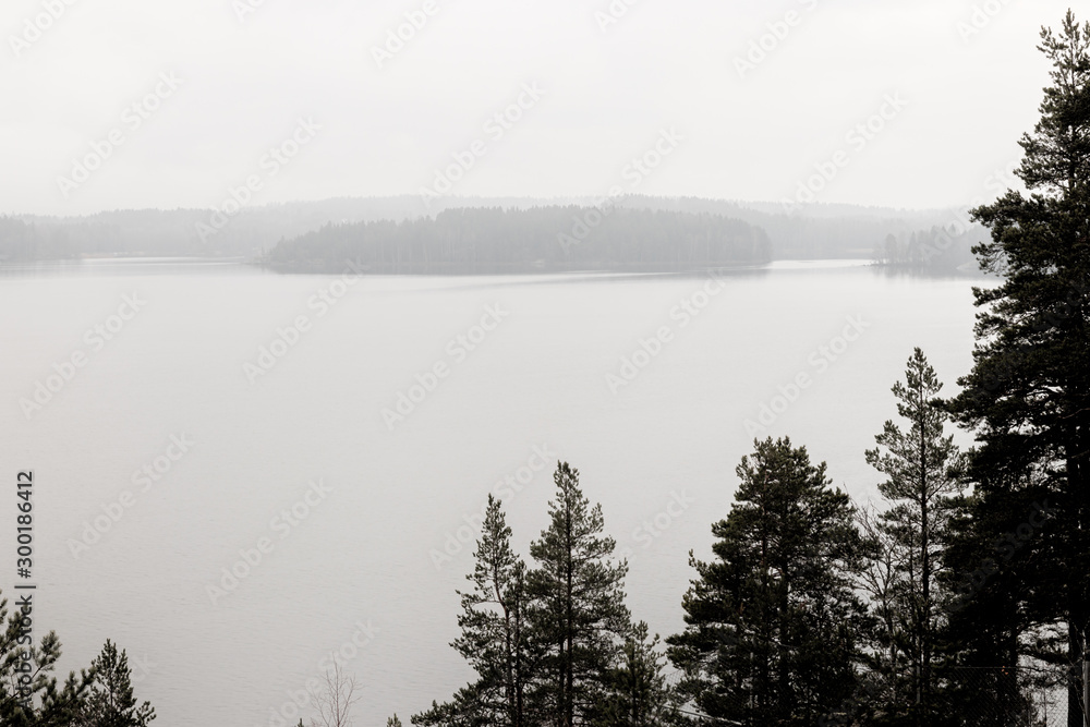 Fototapeta premium Foggy evening at a lake in southern Finland.