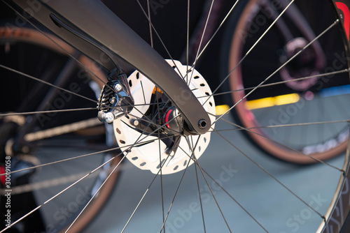 Detail of spokes and fork of professional bicycle wheel. Italian cycling tour June 2, 2019 in Verona, Italy.