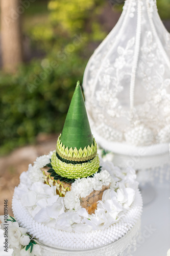 Engagement bowl for Thai engagement ceremony. bride price set, made from banana leaf and garland in thai wedding ceremony for contain wedding ring and flower, KHAN MAAK.  photo